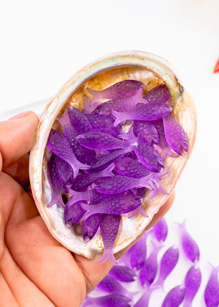 Amethyst Purple German Resin Fish Charm featuring a realistic 27mm sardine pendant. Perfect for ocean charms, beach jewelry, fisherman aesthetic accessories, coastal earrings, nautical jewelry, mermaidcore designs, and handmade jewelry making.