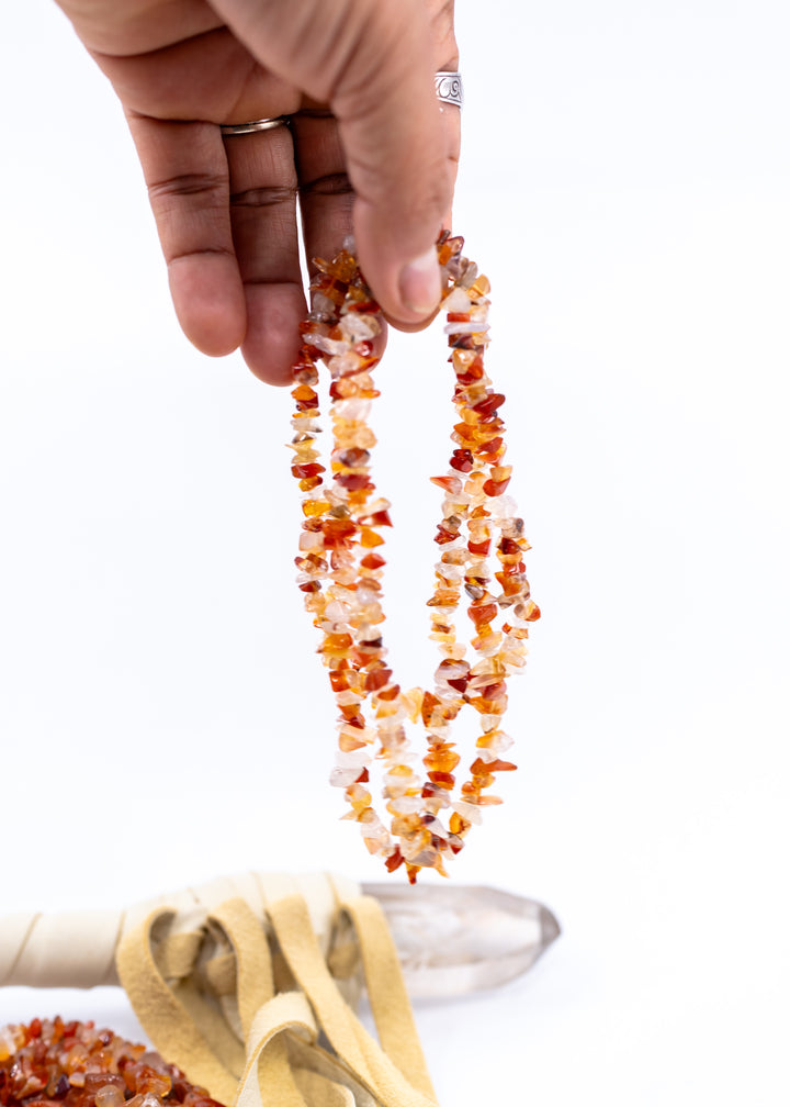 Natural Carnelian chip beads featuring warm orange and red semi-precious gemstone chips on a 34 inch strand. Perfect for boho jewelry making, crystal-inspired designs, bracelets, necklaces, malas, earrings, and artisan gemstone creations.