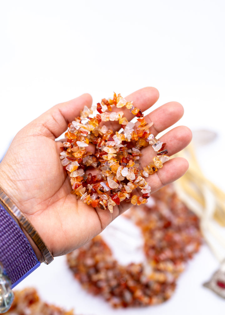Natural Carnelian chip beads featuring warm orange and red semi-precious gemstone chips on a 34 inch strand. Perfect for boho jewelry making, crystal-inspired designs, bracelets, necklaces, malas, earrings, and artisan gemstone creations.