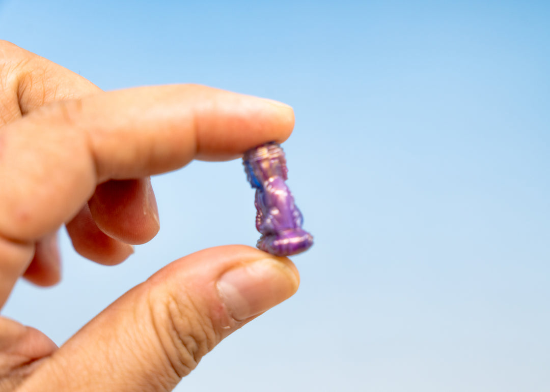 Shop a Galaxy Purple Buddha pendant in 25mm marbled resin. Lightweight sitting Buddha charm for necklaces, malas, meditation and spiritual jewelry.