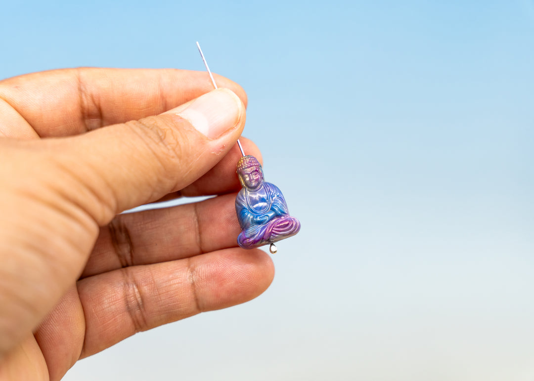 Shop a Galaxy Purple Buddha pendant in 25mm marbled resin. Lightweight sitting Buddha charm for necklaces, malas, meditation and spiritual jewelry.