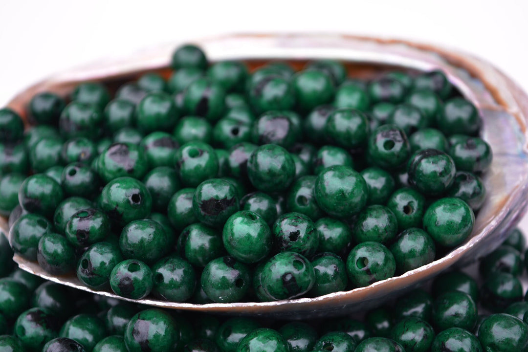 Acai Beads Deep Emerald Green close up of the holes
