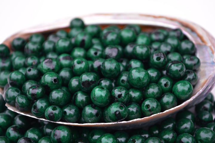 Acai Beads Deep Emerald Green close up of the holes