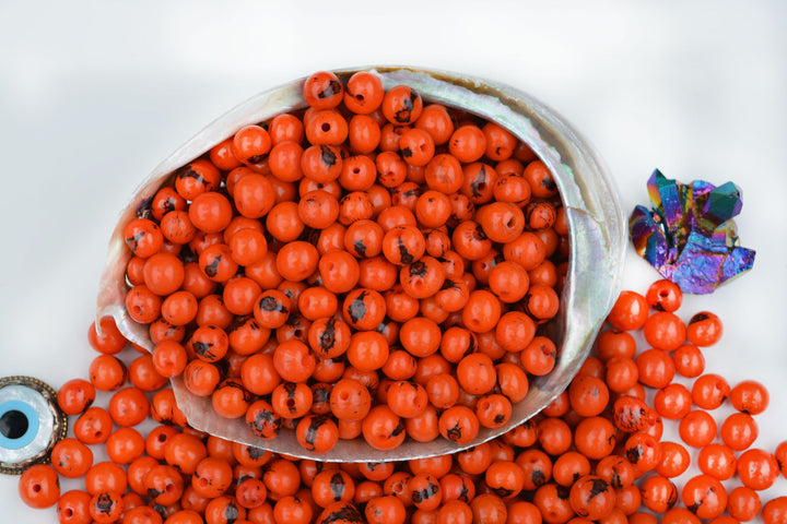 Fire orange acai seed beads close up natural texture