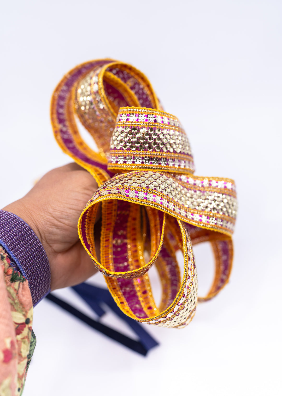 Gold sequin Indian trim with pink and yellow embroidered sari border detail. Decorative boho ribbon trim perfect for sewing, costumes, festival fashion, textile art, belly dance wear, handbags, pillows, and mixed media projects.
