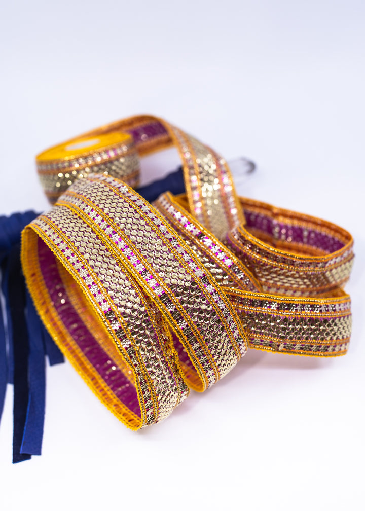 Gold sequin Indian trim with pink and yellow embroidered sari border detail. Decorative boho ribbon trim perfect for sewing, costumes, festival fashion, textile art, belly dance wear, handbags, pillows, and mixed media projects.