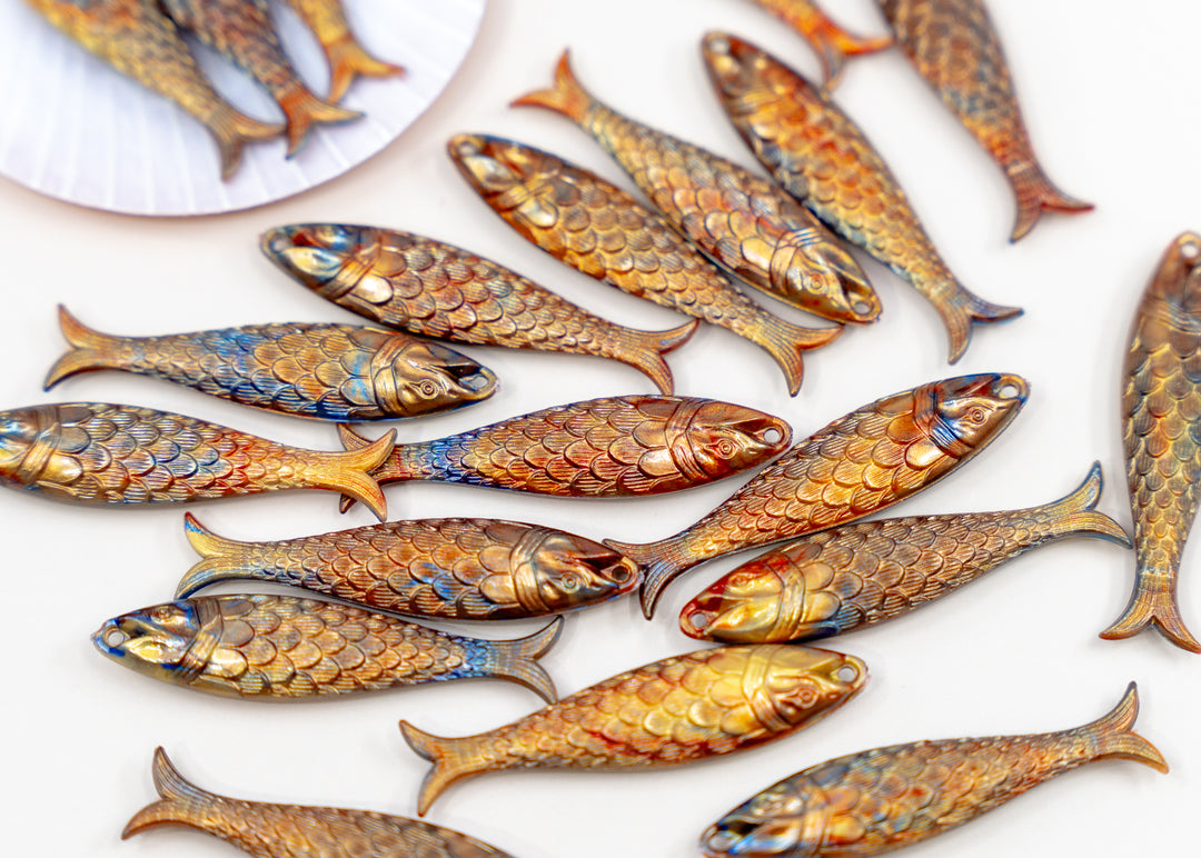 Golden Hour, Bronze German Resin Fish Charm featuring a realistic 48mm sardine pendant. Perfect for ocean charms, beach jewelry, fisherman aesthetic accessories, coastal jewelry, nautical designs, handmade earrings, necklaces, keychains, and artisan jewelry making.