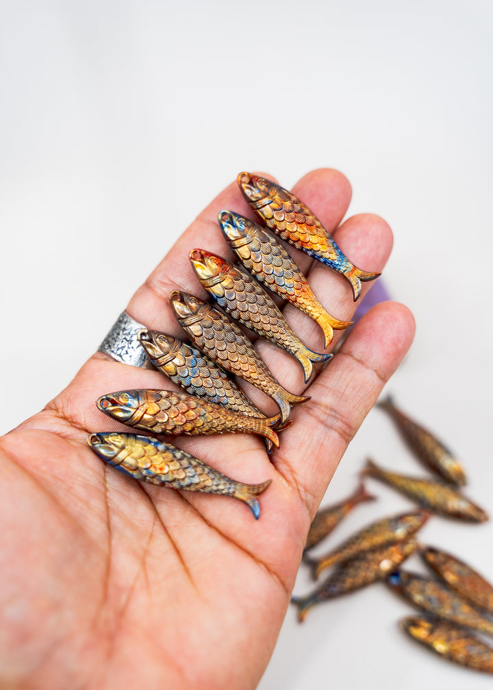 Golden Hour, Bronze German Resin Fish Charm featuring a realistic 48mm sardine pendant. Perfect for ocean charms, beach jewelry, fisherman aesthetic accessories, coastal jewelry, nautical designs, handmade earrings, necklaces, keychains, and artisan jewelry making.