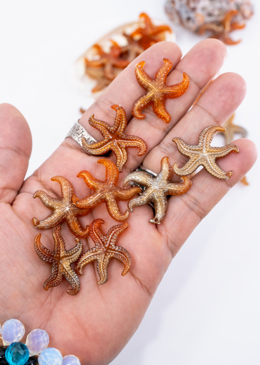 Golden Hour German resin starfish charm with warm amber and bronze marbling. Lightweight 30mm coastal pendant for beach jewelry, ocean-inspired crafts, and DIY jewelry making.