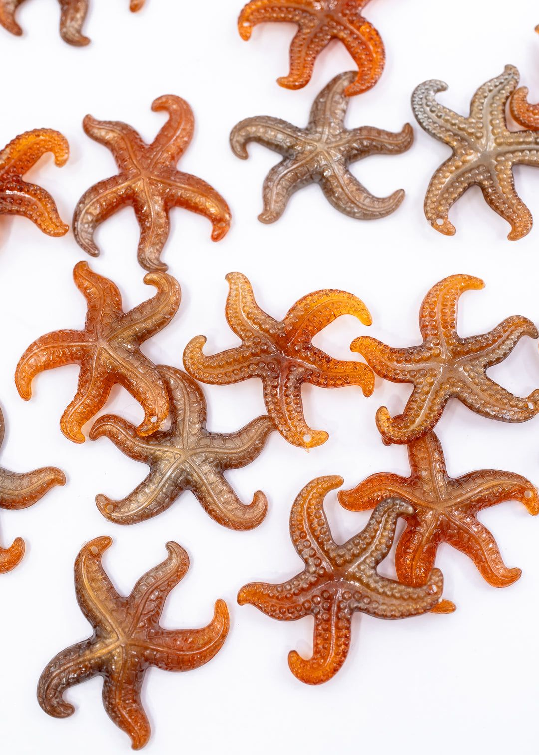 Golden Hour German resin starfish charm with warm amber and bronze marbling. Lightweight 30mm coastal pendant for beach jewelry, ocean-inspired crafts, and DIY jewelry making.
