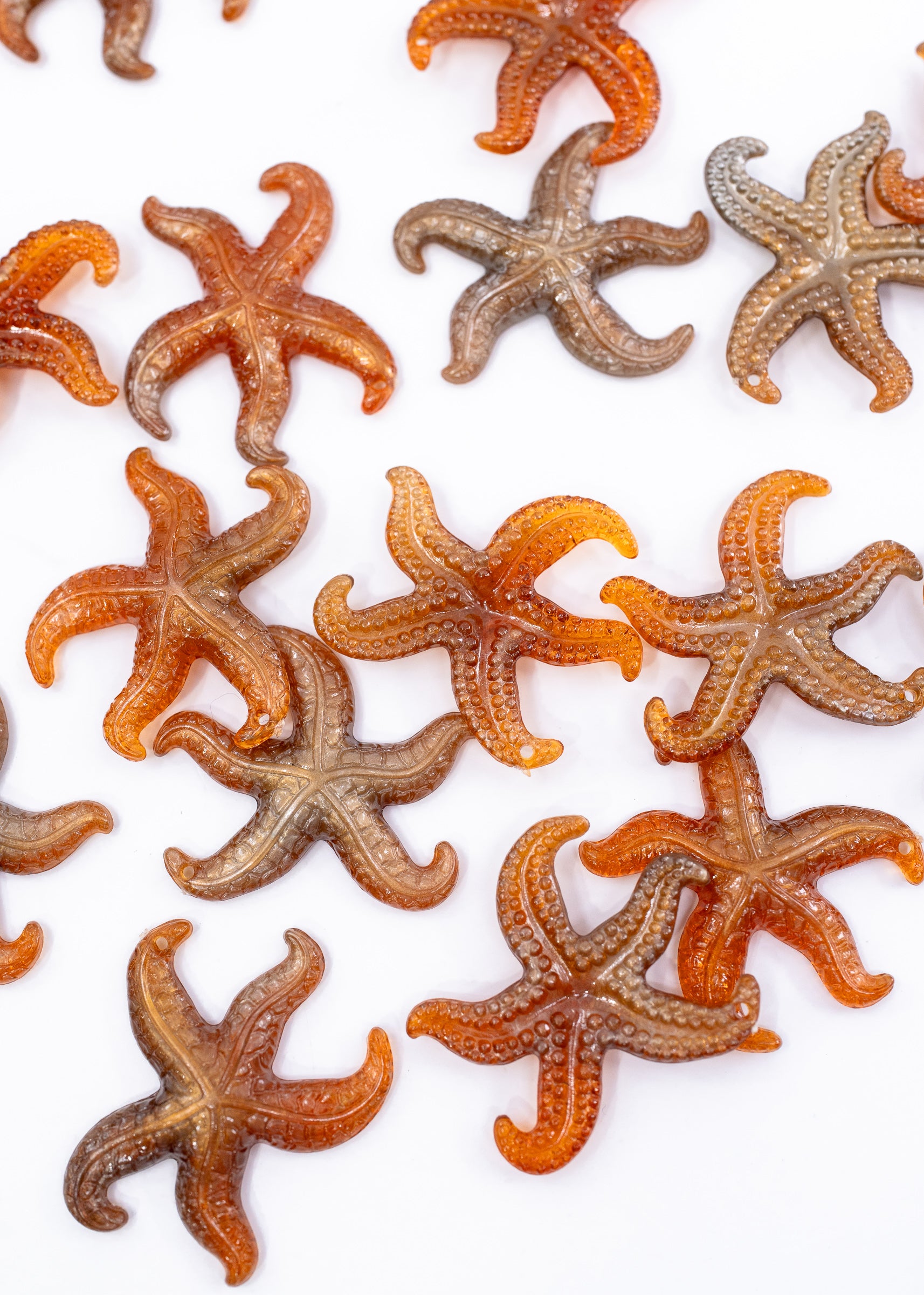Golden Hour German resin starfish charm with warm amber and bronze marbling. Lightweight 30mm coastal pendant for beach jewelry, ocean-inspired crafts, and DIY jewelry making.