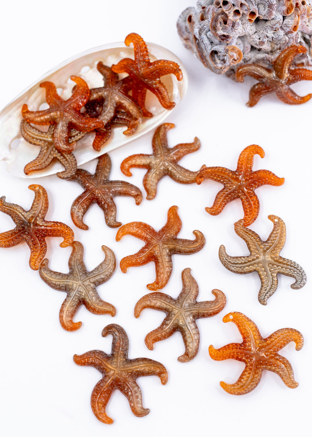 Golden Hour German resin starfish charm with warm amber and bronze marbling. Lightweight 30mm coastal pendant for beach jewelry, ocean-inspired crafts, and DIY jewelry making.