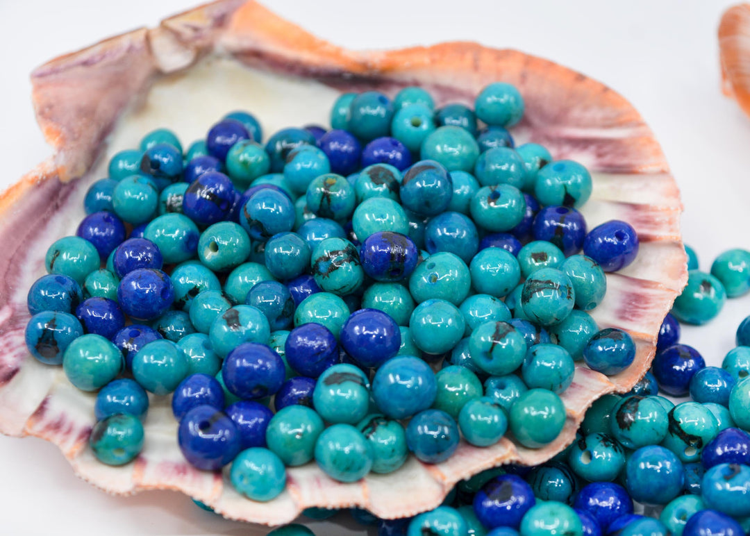 Close up of Blue Acai beads showing th black pattern.