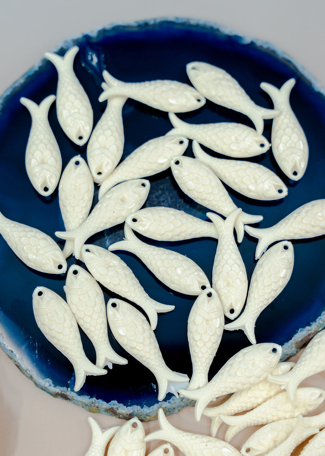 Shop Ivory White German resin fish charms, 27mm lightweight sardine pendants for earrings, fisherman aesthetic, coastal and nautical jewelry designs.