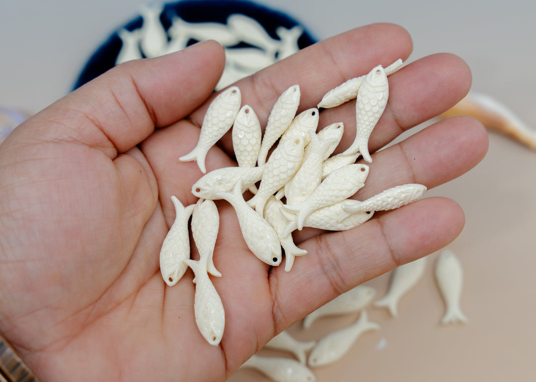 Shop Ivory White German resin fish charms, 27mm lightweight sardine pendants for earrings, fisherman aesthetic, coastal and nautical jewelry designs.