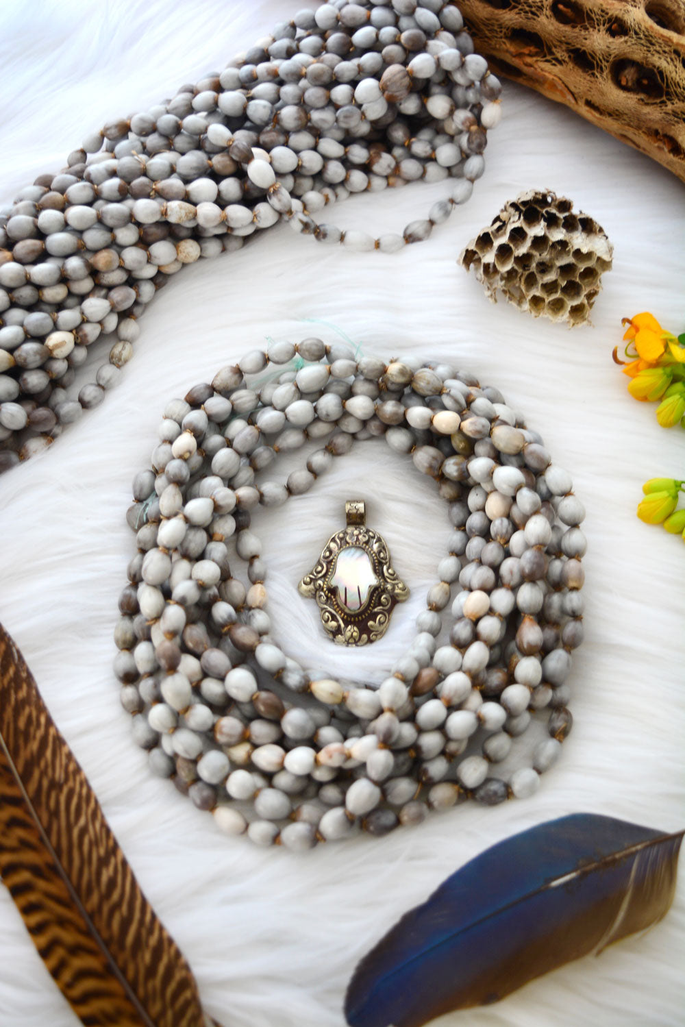 Natural Job’s Tears seed beads in earthy gray neutral tones featuring organic oval botanical beads for boho jewelry making, tribal necklaces, malas, meditation jewelry, mixed media art, and rustic artisan designs.