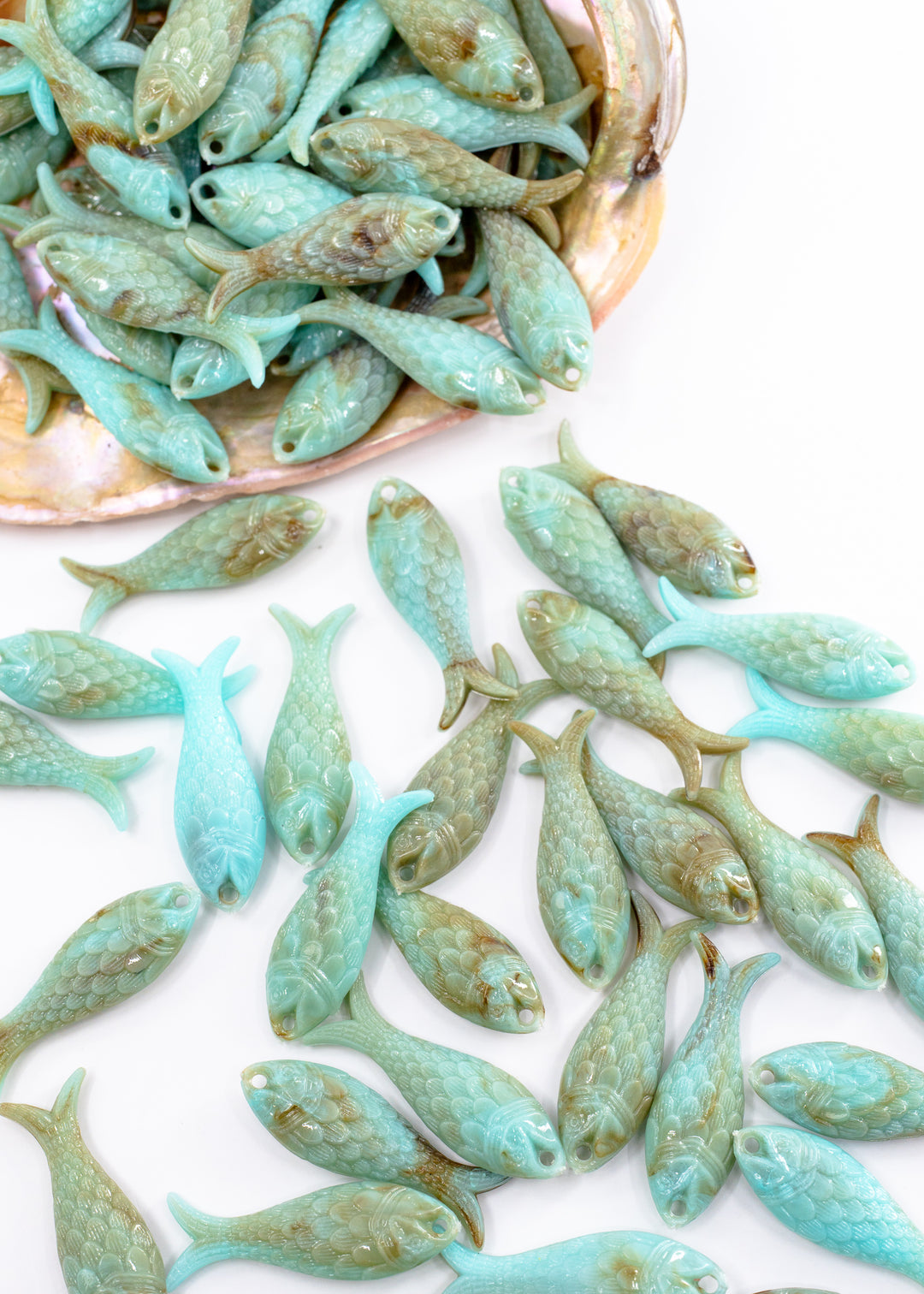 Marble Aqua blue fish charms handmade from glitter German resin featuring marbled sardine pendants perfect for ocean jewelry, mermaidcore accessories, beach fashion, coastal earrings, whimsical summer jewelry, and festival-inspired designs. These fish ocean charms are waterproof and perfect for beach jewelry.