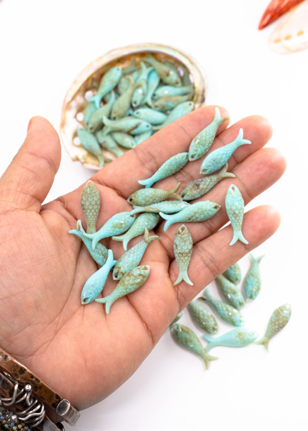 Marble Aqua blue fish charms handmade from glitter German resin featuring marbled sardine pendants perfect for ocean jewelry, mermaidcore accessories, beach fashion, coastal earrings, whimsical summer jewelry, and festival-inspired designs. These fish ocean charms are waterproof and perfect for beach jewelry.