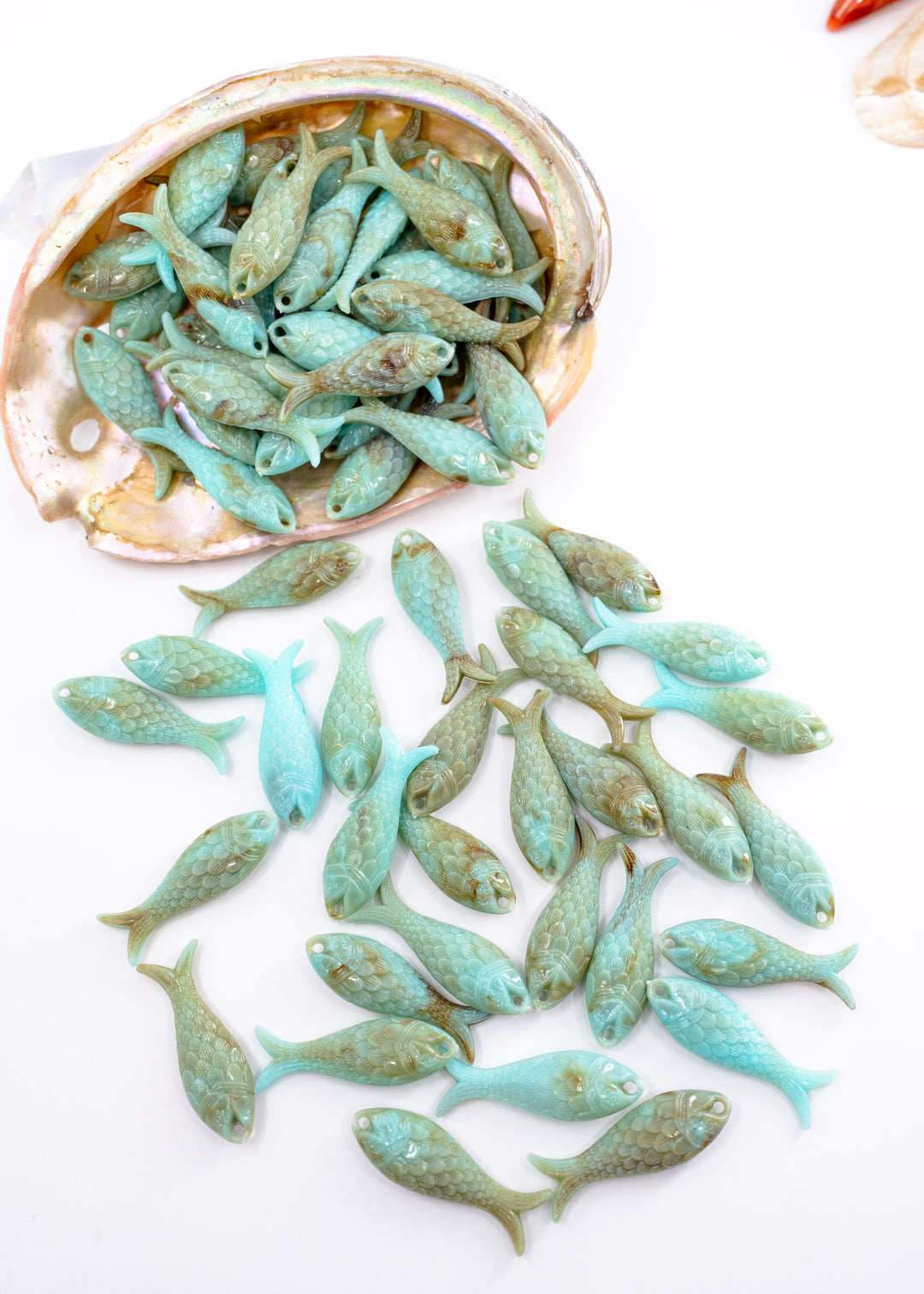 Marble Aqua blue fish charms handmade from glitter German resin featuring marbled sardine pendants perfect for ocean jewelry, mermaidcore accessories, beach fashion, coastal earrings, whimsical summer jewelry, and festival-inspired designs. These fish ocean charms are waterproof and perfect for beach jewelry.