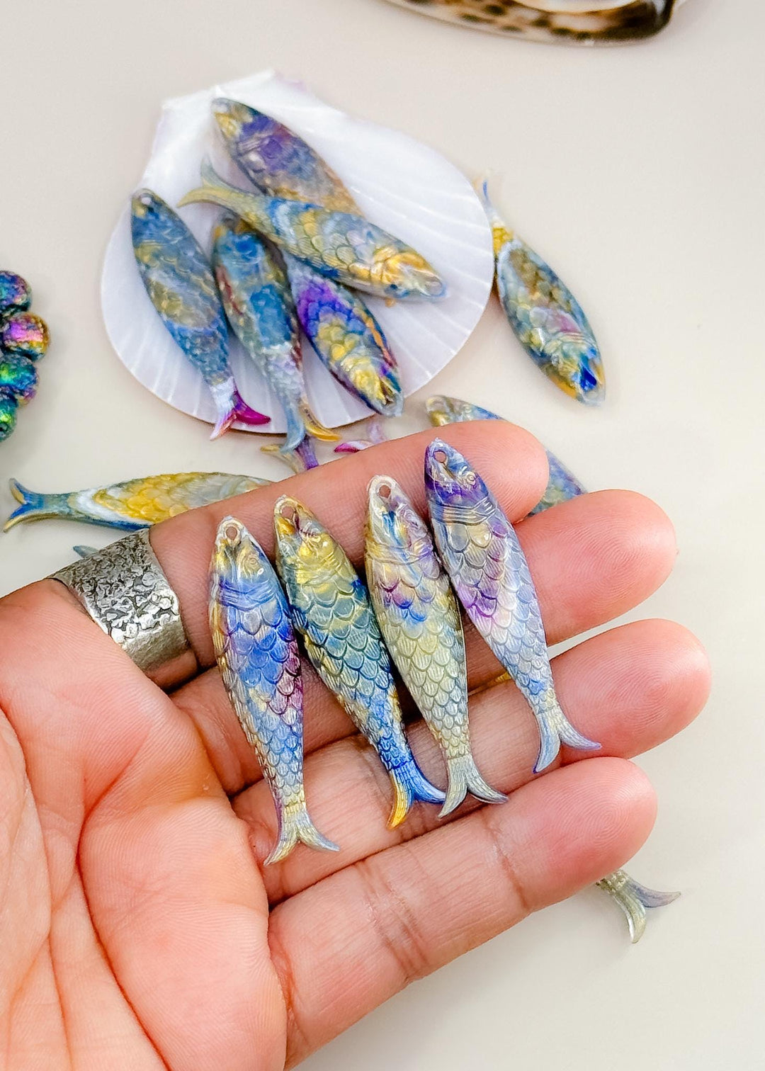 Marble Purple and Blue fish charms handmade from German resin featuring iridescent sardine pendants in coral and magenta tones. Perfect for ocean jewelry, mermaidcore accessories, coastal earrings, beach fashion, whimsical summer jewelry, and playful statement designs.