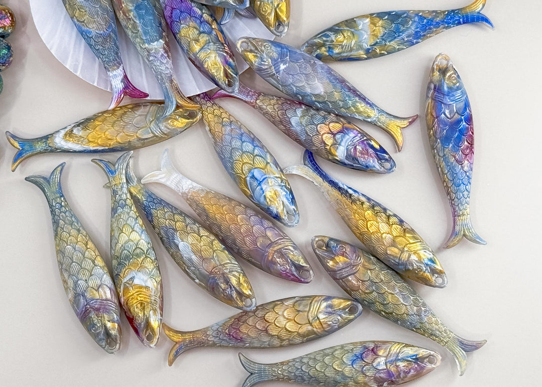 Marble Purple and Blue fish charms handmade from German resin featuring iridescent sardine pendants in coral and magenta tones. Perfect for ocean jewelry, mermaidcore accessories, coastal earrings, beach fashion, whimsical summer jewelry, and playful statement designs.