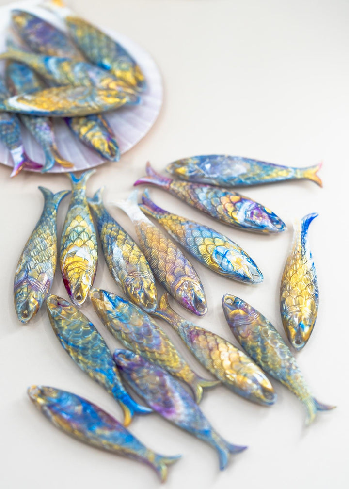 Marble Purple and Blue fish charms handmade from German resin featuring iridescent sardine pendants in coral and magenta tones. Perfect for ocean jewelry, mermaidcore accessories, coastal earrings, beach fashion, whimsical summer jewelry, and playful statement designs.