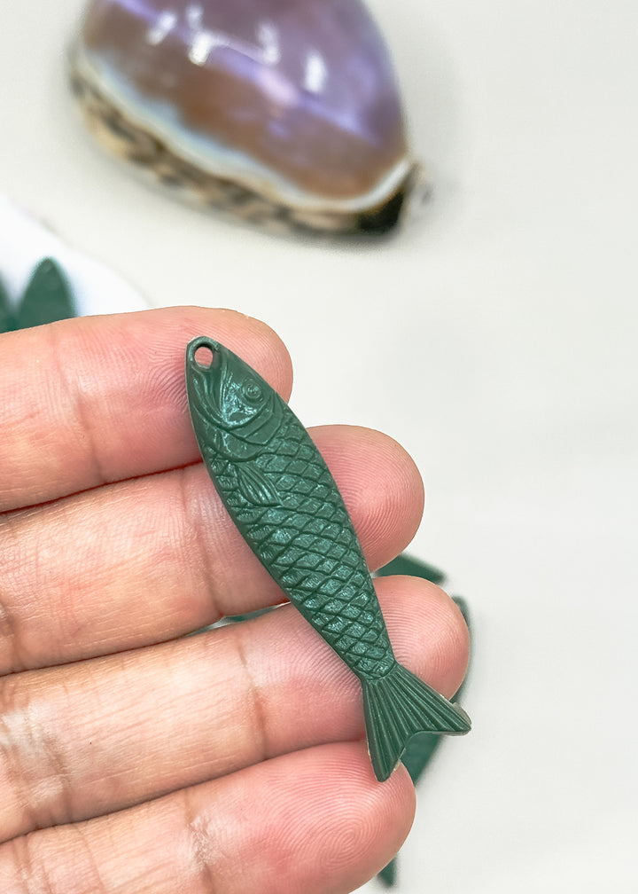 A dark green fish-shaped pendant or charm for fisherman aesthetics jewelry making.