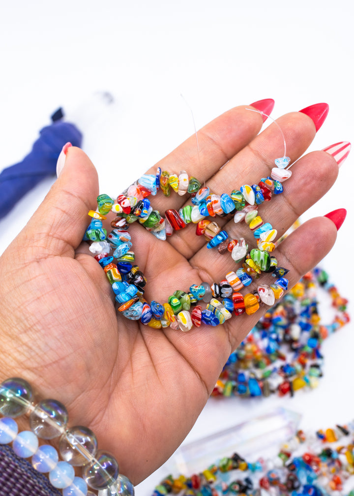 Multicolor millefiori glass chip beads featuring vibrant mosaic-style artisan glass in assorted rainbow colors. Perfect for boho jewelry making, layered necklaces, bracelets, earrings, mixed media art, and eclectic handmade designs.