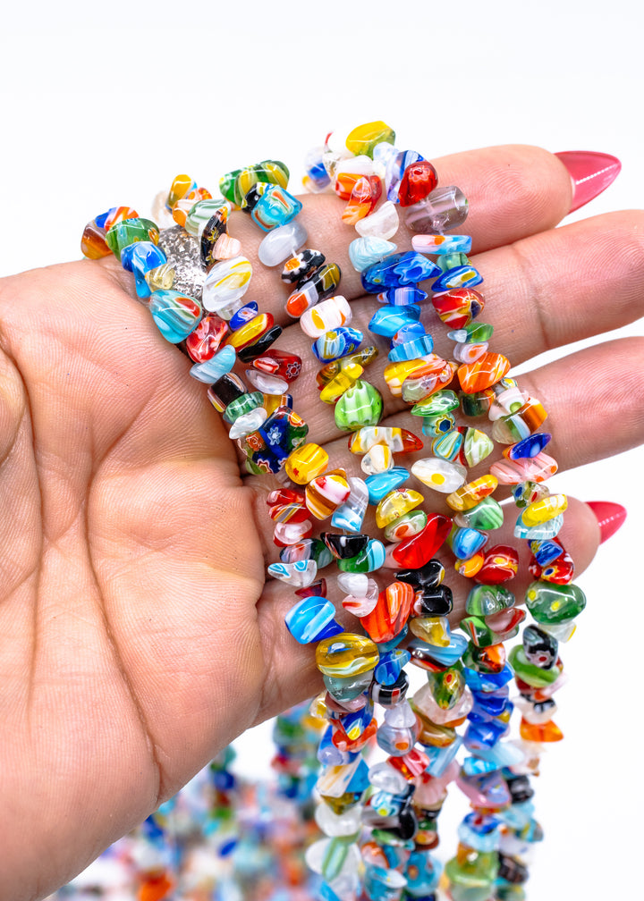 Multicolor millefiori glass chip beads featuring vibrant mosaic-style artisan glass in assorted rainbow colors. Perfect for boho jewelry making, layered necklaces, bracelets, earrings, mixed media art, and eclectic handmade designs.