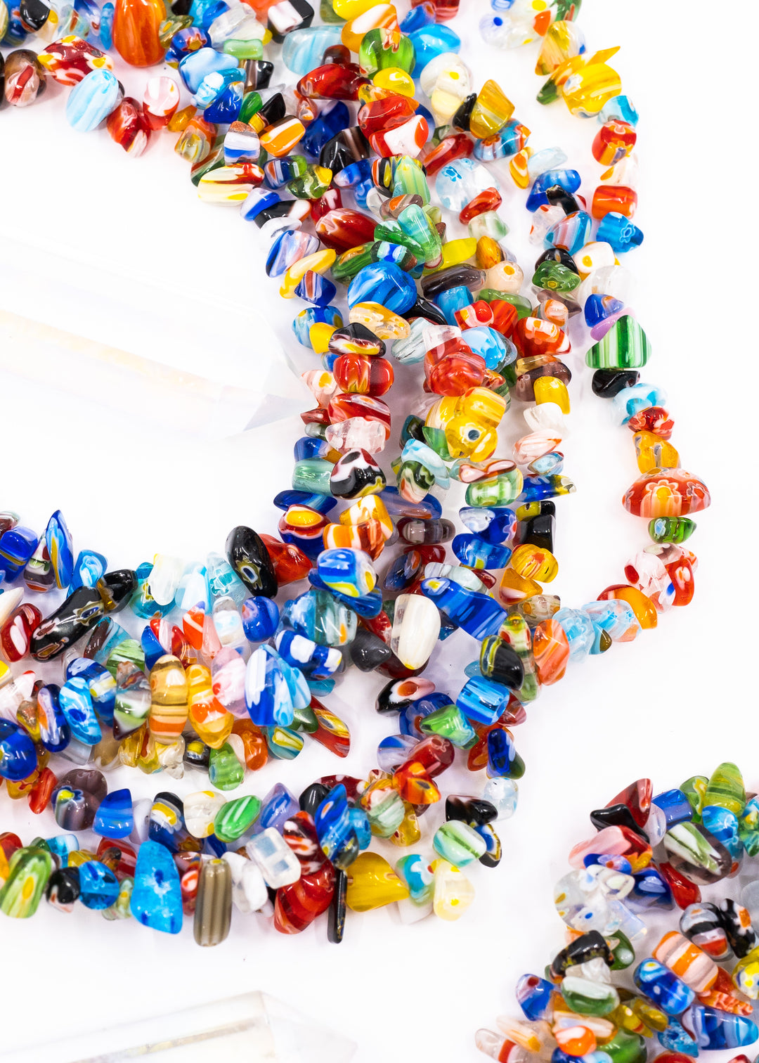 Multicolor millefiori glass chip beads featuring vibrant mosaic-style artisan glass in assorted rainbow colors. Perfect for boho jewelry making, layered necklaces, bracelets, earrings, mixed media art, and eclectic handmade designs.