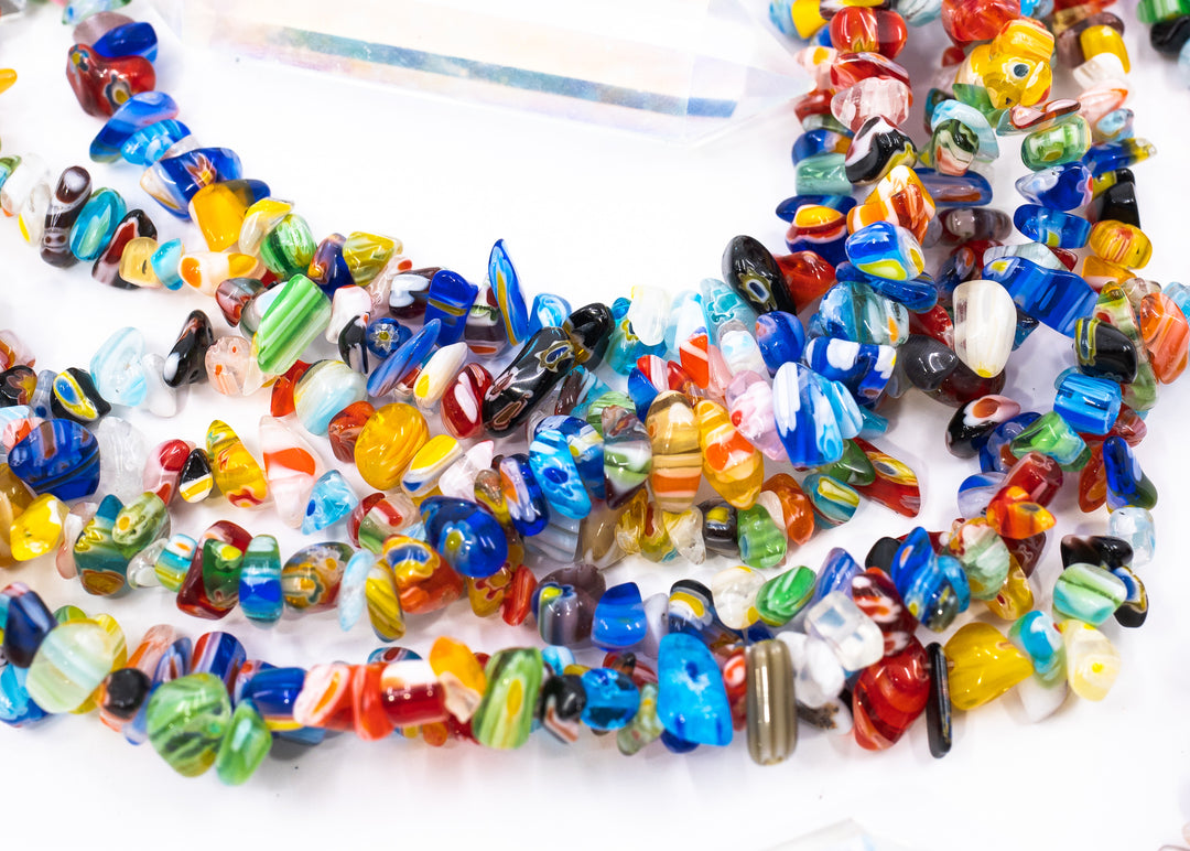 Multicolor millefiori glass chip beads featuring vibrant mosaic-style artisan glass in assorted rainbow colors. Perfect for boho jewelry making, layered necklaces, bracelets, earrings, mixed media art, and eclectic handmade designs.