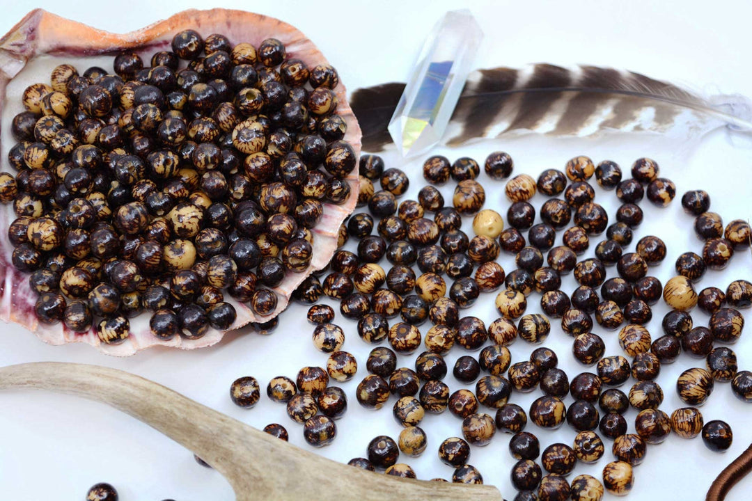 Spread of Natural Acai Beads from the Amazon showing the varying sizes.