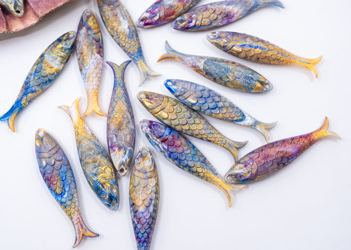 Ocean Aurora German Resin Fish Charm featuring a realistic 48mm sardine pendant. Perfect for ocean charms, beach jewelry, fisherman aesthetic accessories, coastal jewelry, nautical designs, handmade earrings, necklaces, keychains, and artisan jewelry making.