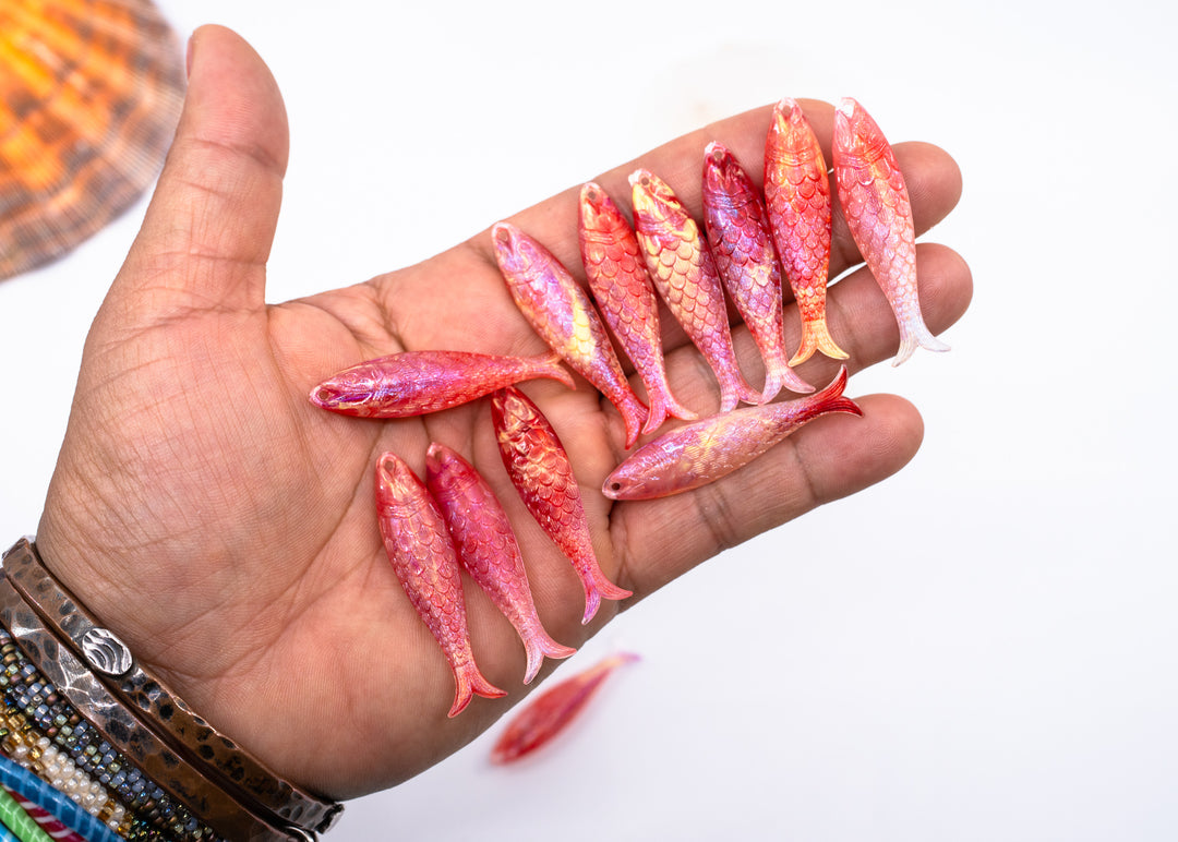 Pink mermaid glitter fish charms handmade from German resin featuring iridescent sardine pendants in coral and magenta tones. Perfect for ocean jewelry, mermaidcore accessories, coastal earrings, beach fashion, whimsical summer jewelry, and playful statement designs.