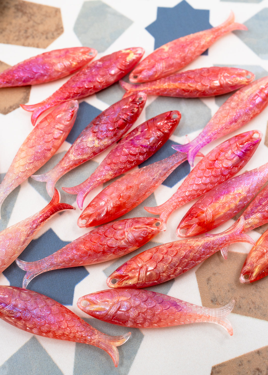 Pink mermaid glitter fish charms handmade from German resin featuring iridescent sardine pendants in coral and magenta tones. Perfect for ocean jewelry, mermaidcore accessories, coastal earrings, beach fashion, whimsical summer jewelry, and playful statement designs.