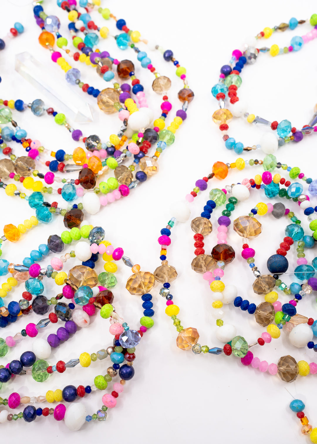 Rainbow Sparkle Acrylic Beads featuring assorted faceted acrylic beads in bright rainbow colors on a 16 inch strand for jewelry making, bracelets, sun catchers, and craft projects