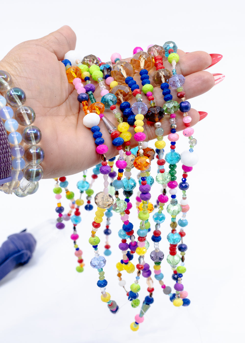 Close up of Rainbow Sparkle Acrylic Beads featuring mixed shapes, bright colors, and faceted finishes
