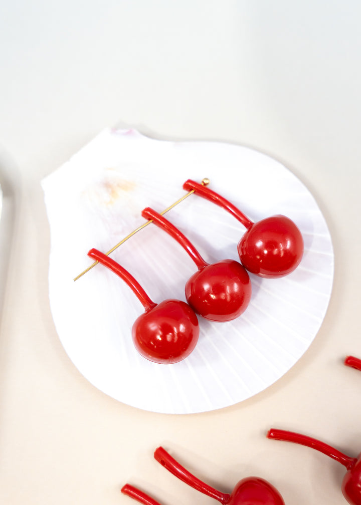 Shop Red Cherry German resin beads, 31mm lightweight kitschy fruit beads for cherry earrings, statement jewelry and colorful DIY accessories.