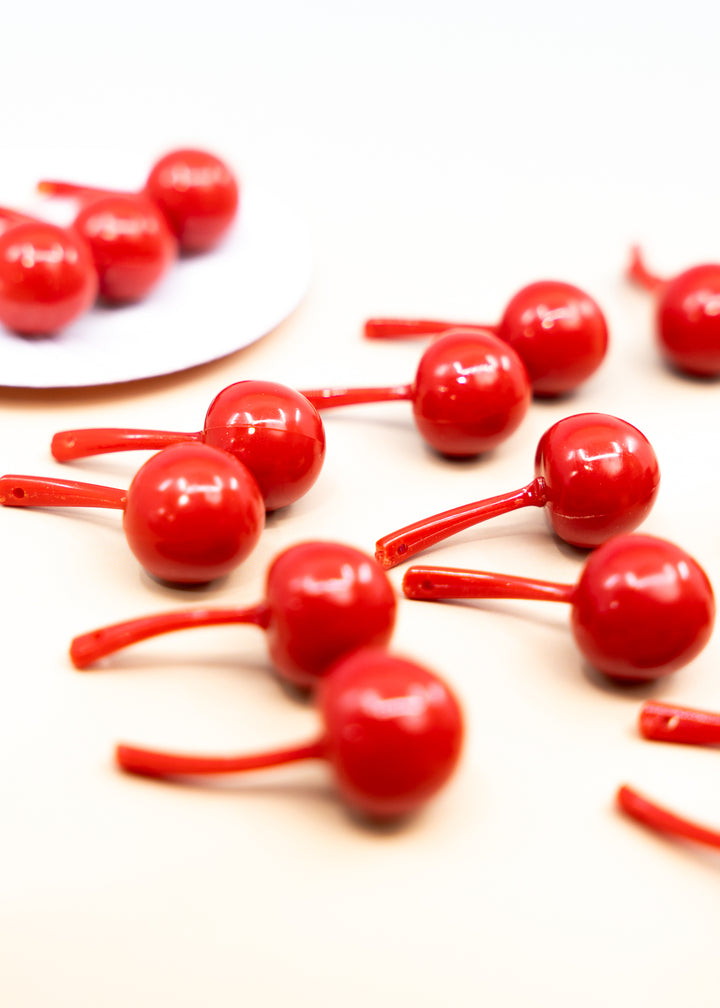 Shop Red Cherry German resin beads, 31mm lightweight kitschy fruit beads for cherry earrings, statement jewelry and colorful DIY accessories.