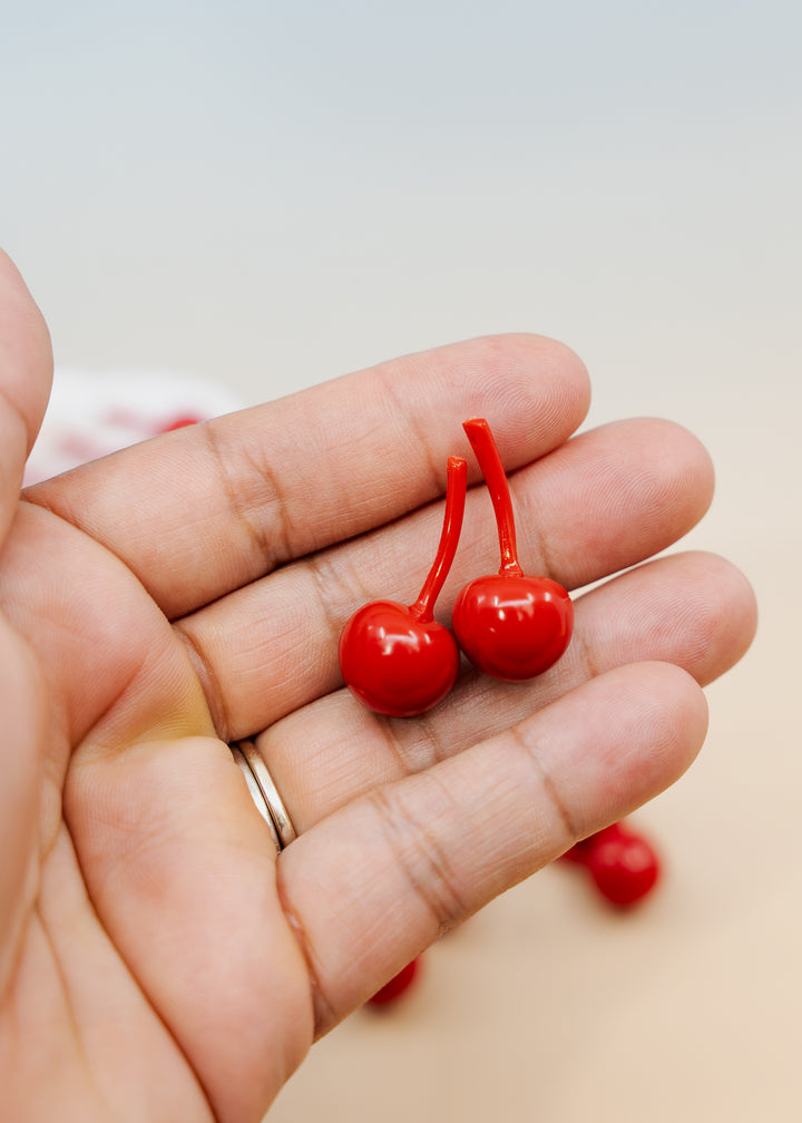 Shop Red Cherry German resin beads, 31mm lightweight kitschy fruit beads for cherry earrings, statement jewelry and colorful DIY accessories.