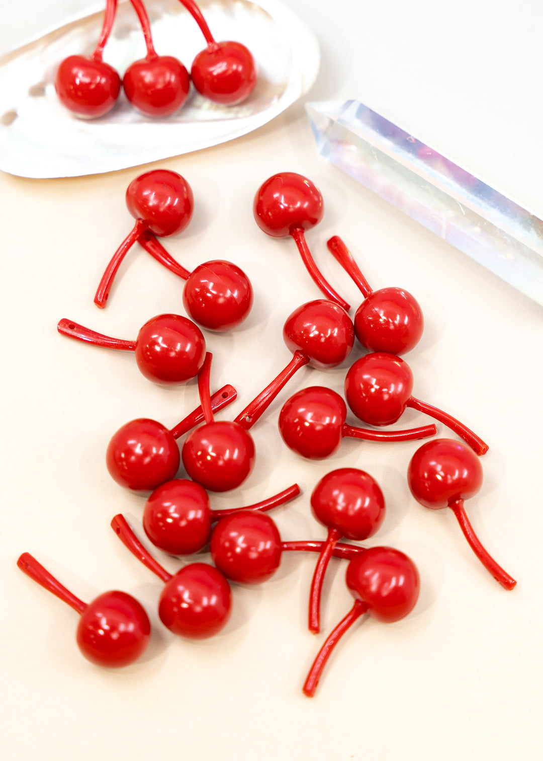 Shop Red Cherry German resin beads, 31mm lightweight kitschy fruit beads for cherry earrings, statement jewelry and colorful DIY accessories.