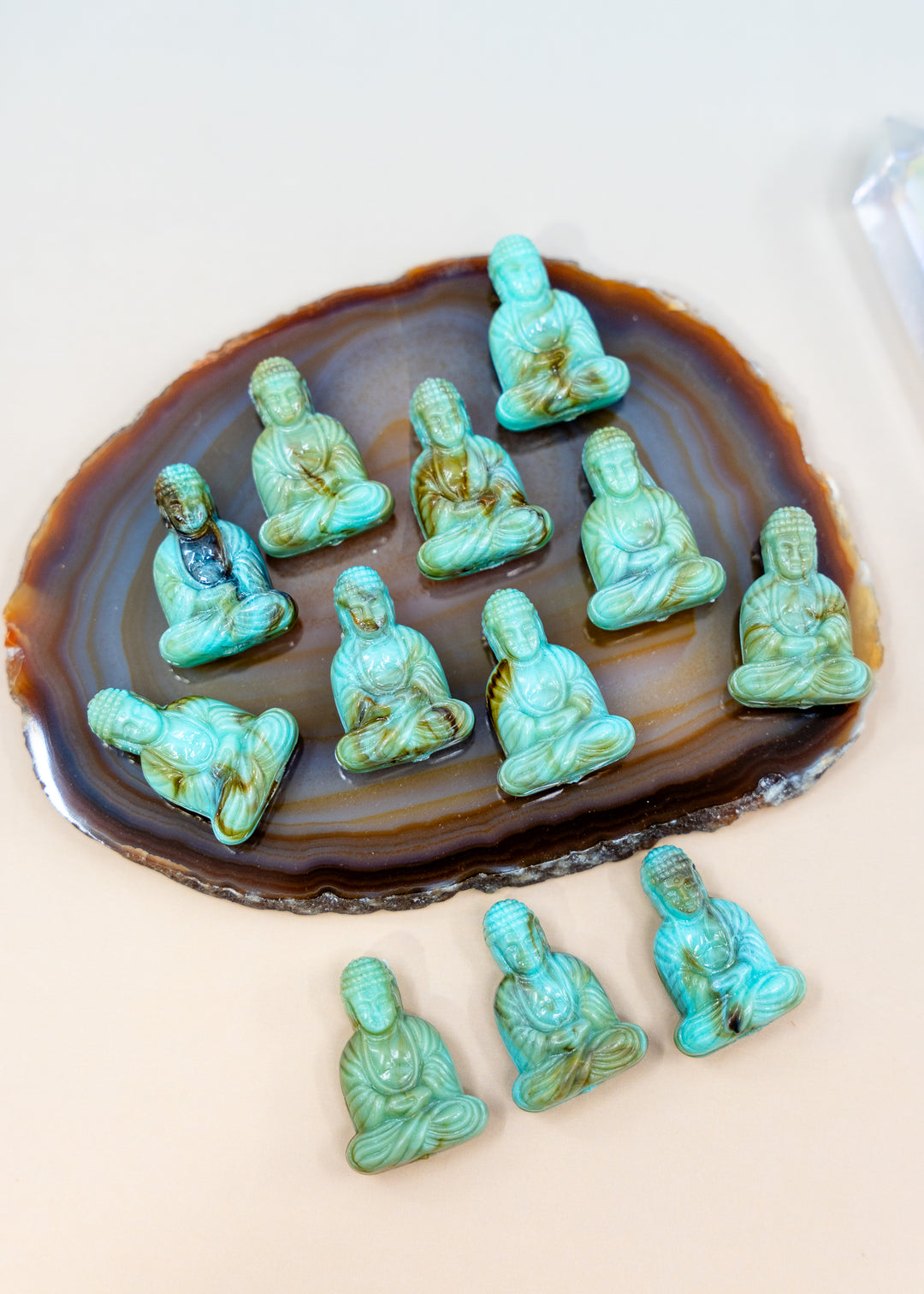 Shop a Lagoon Driftwood Buddha pendant in 25mm marbled resin. Lightweight sitting Buddha charm for necklaces, malas, meditation and spiritual jewelry.