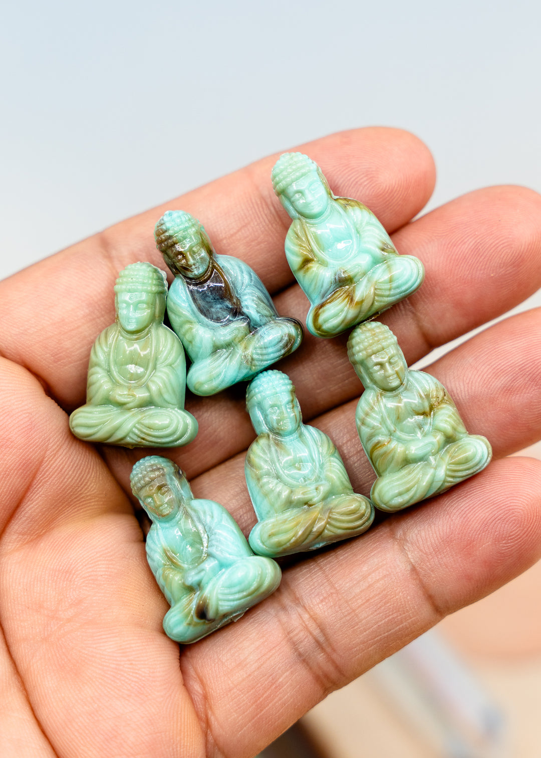 Shop a Lagoon Driftwood Buddha pendant in 25mm marbled resin. Lightweight sitting Buddha charm for necklaces, malas, meditation and spiritual jewelry.