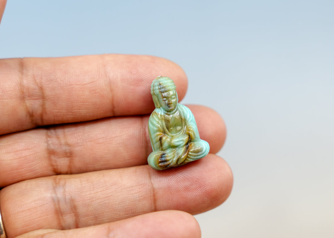 Shop a Lagoon Driftwood Buddha pendant in 25mm marbled resin. Lightweight sitting Buddha charm for necklaces, malas, meditation and spiritual jewelry.