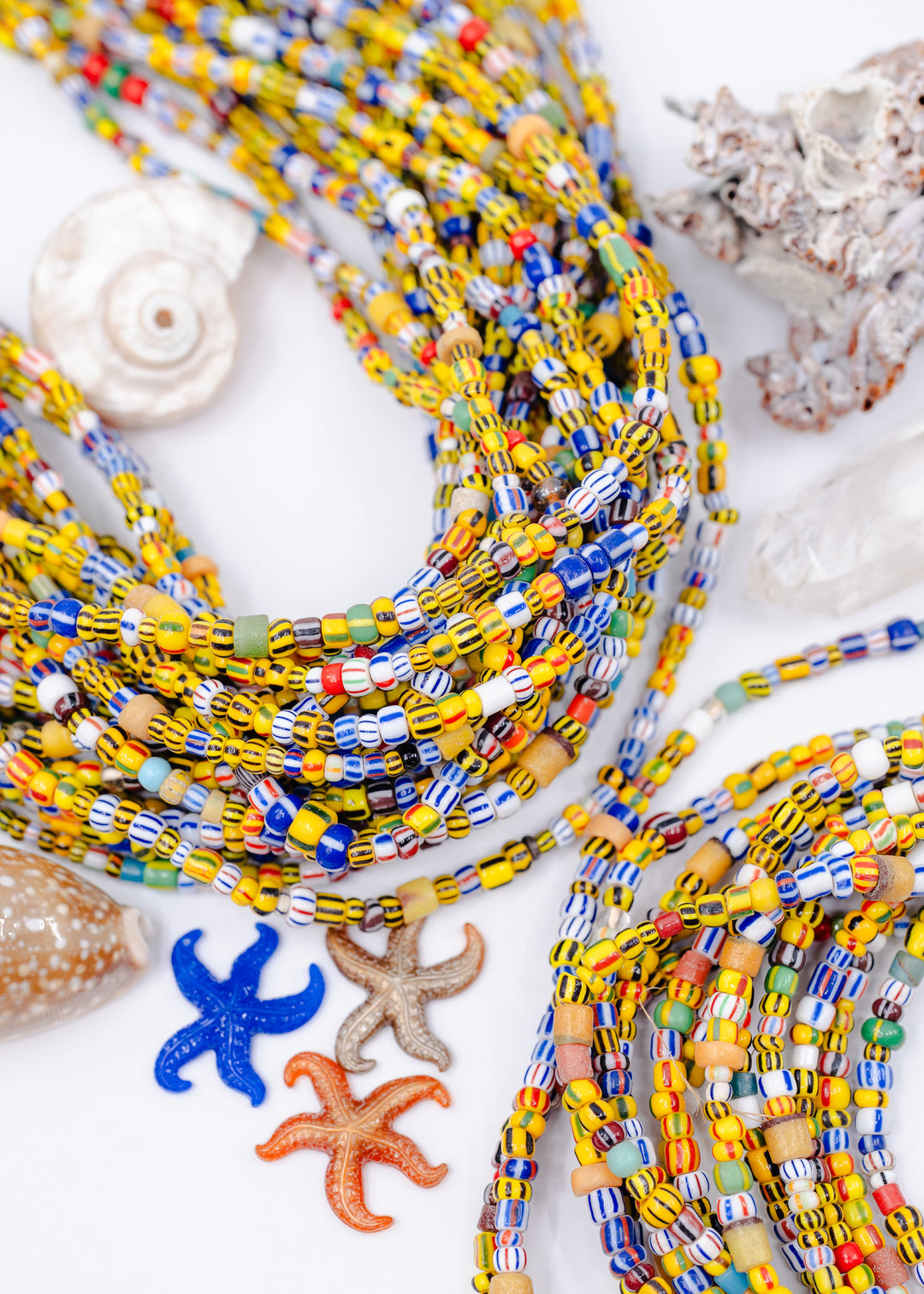 Stripped Ghana Glass Beads from Africa, in a mix of colors featuring a lot of yellows.