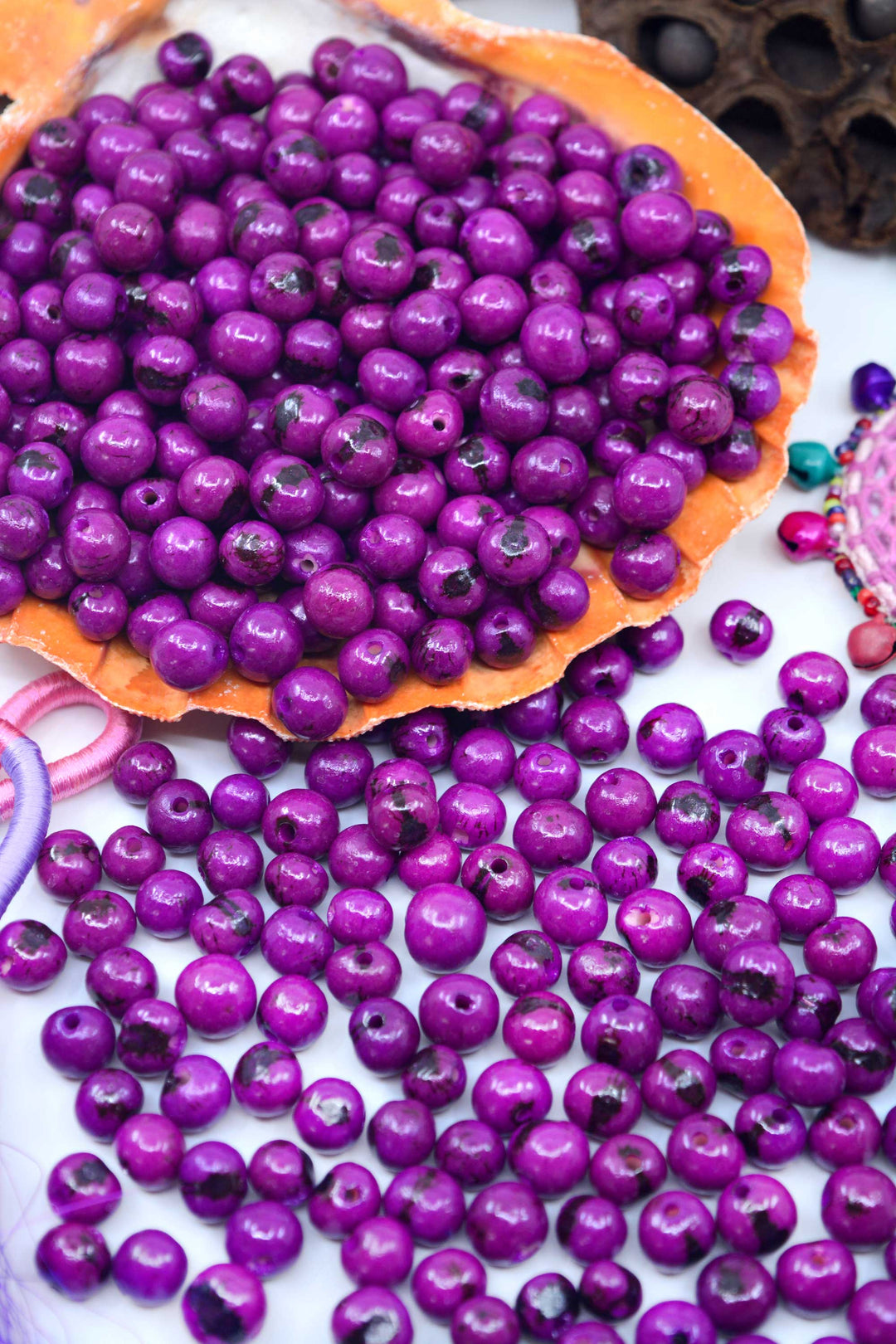 Purple acai beads for jewelry making.