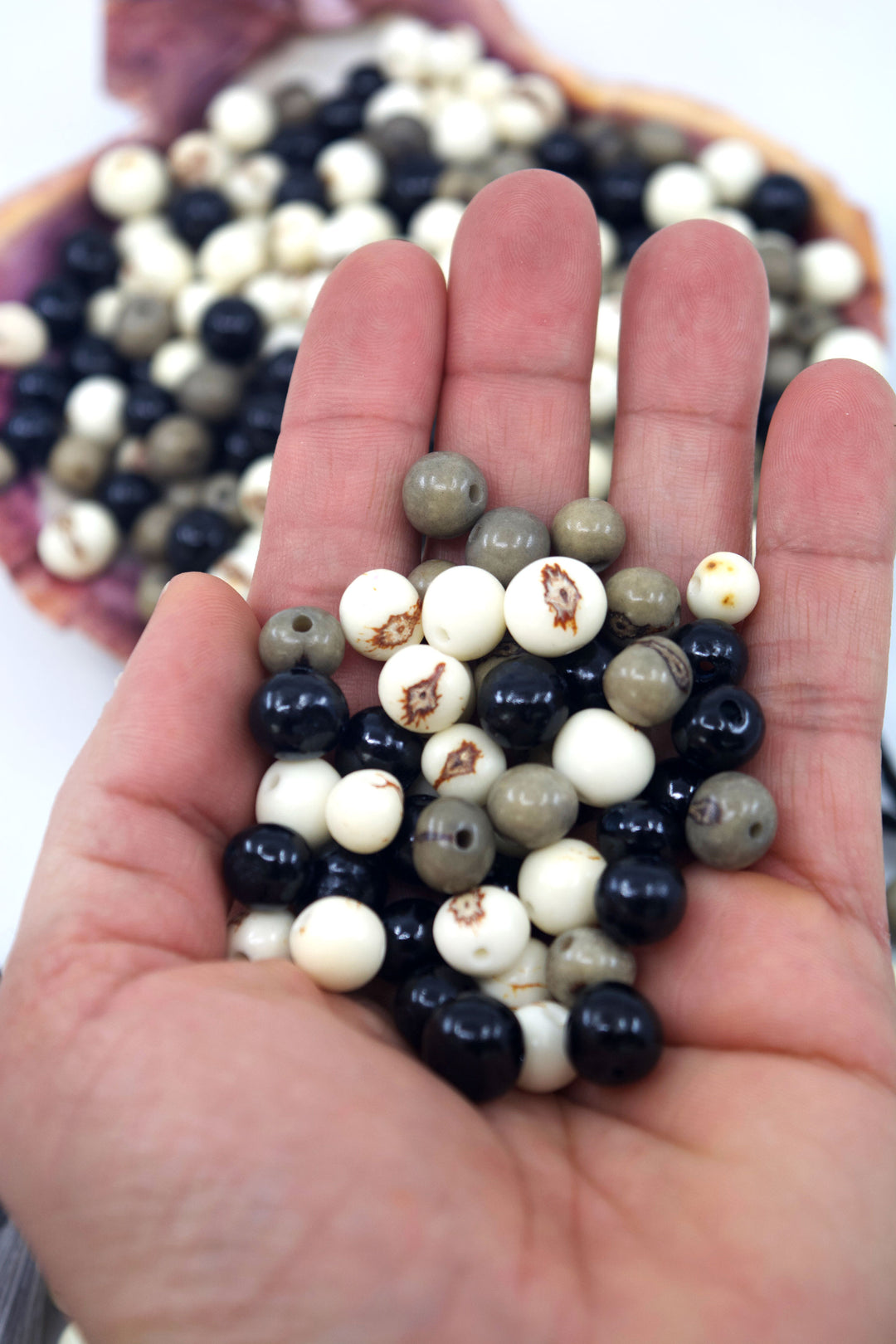 Black Pearl, Black, White and Gray Acai Beads close-up of acai beads.