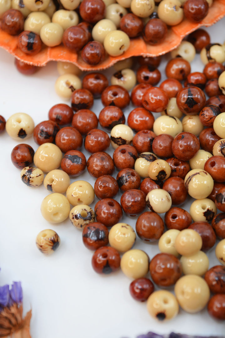 Details of two tones of acai beads for DIY jewelry making