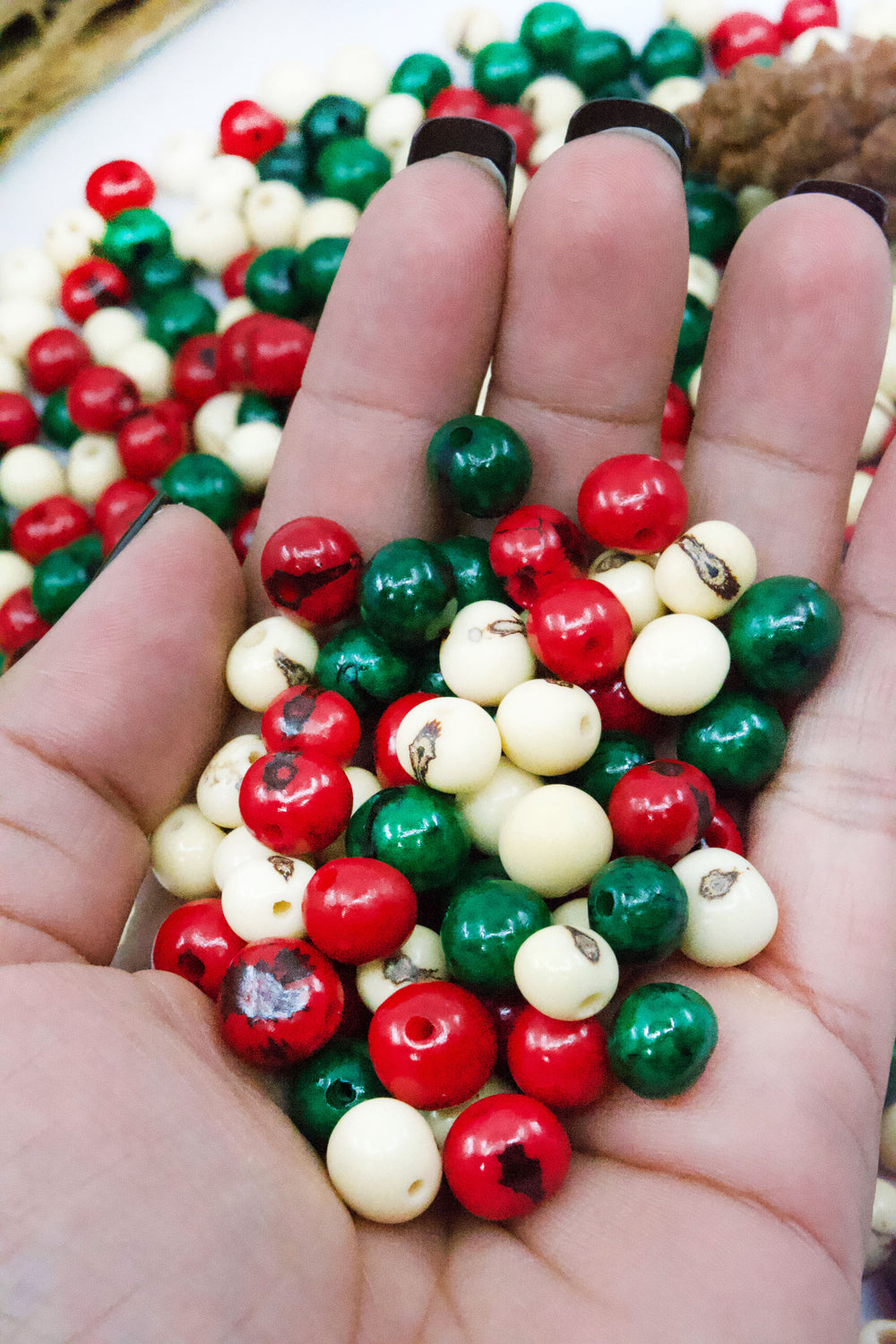 Close-up of a mix of acai beads showing the different colors in the mix.