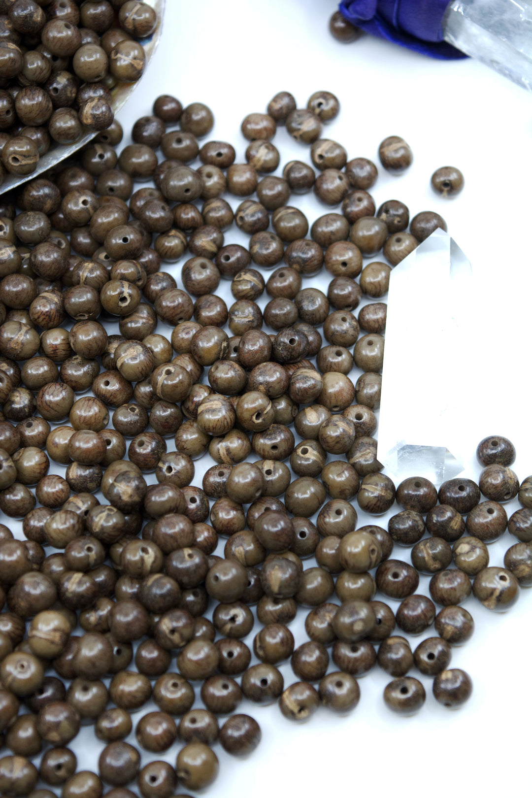 A display of an unusual clay brown color of acai beads for jewelry making.